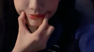 A straight girl's face but with two big grape eyes that look like Jiliji