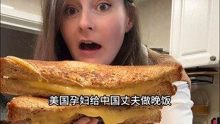 29-year-old American pregnant woman makes dinner at home for her photographer husband