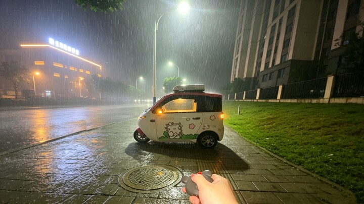 What’s it like to huddle alone in a little electric car on a rainy day?