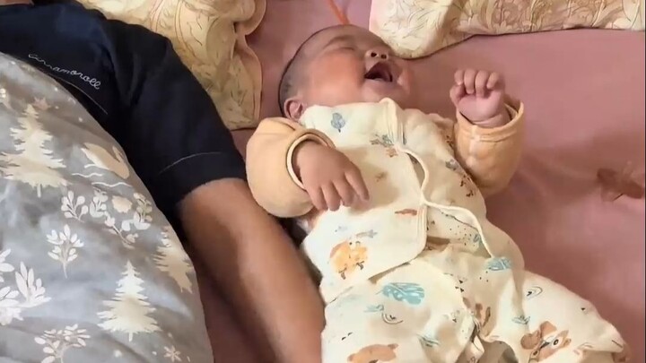 Baby loves playing with Daddy the most—just tease him and he bursts into giggles!