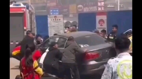 A small car blocked the fire lane, and concerned citizens worked together to move it.