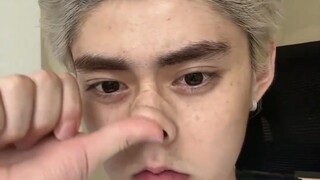 A guy films himself squishing his own face to prove he’s naturally good-looking and hasn’t had plast