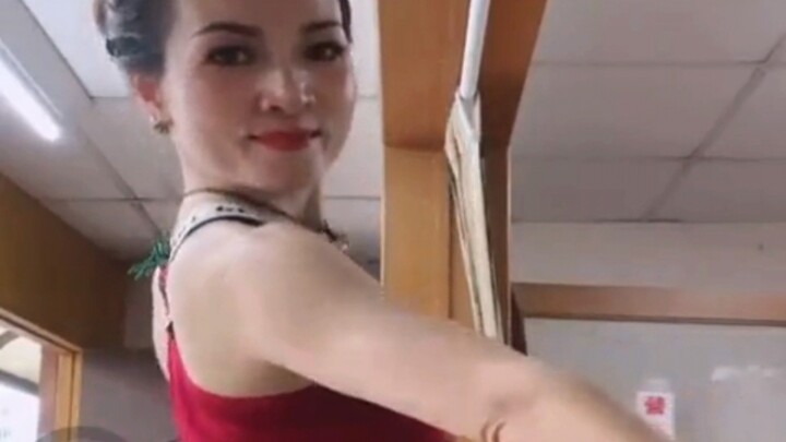 Watch the shop owner lady doing health dance