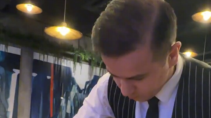 Do you have to wait until the servers are done having fun before you can eat at this restaurant?