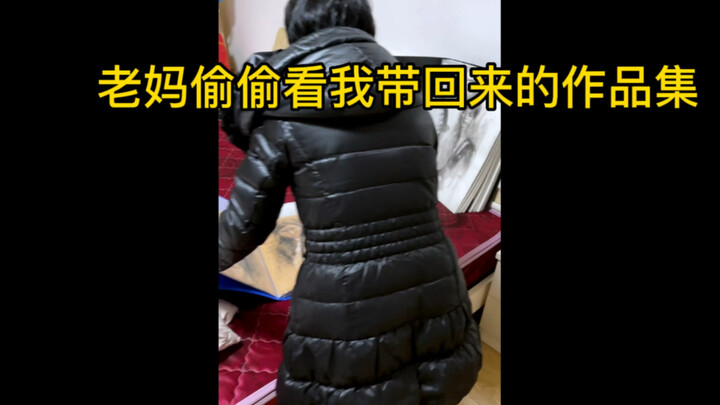 Mom is secretly admiring my art book.