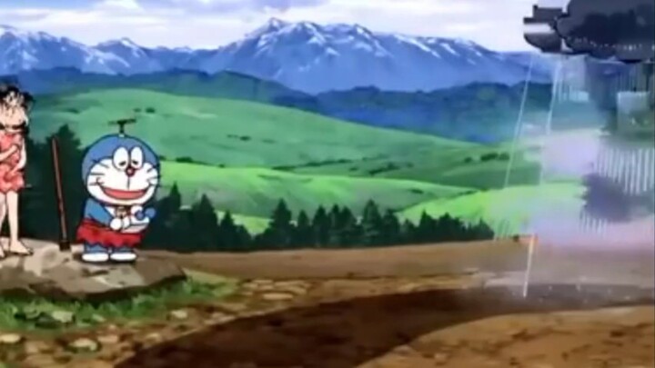 doraemon sedang menyiram ladang