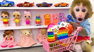 Monkey Baby Bon Bon doing shopping in Car Toy store and eat Kinder Joy Egg chocolate with puppy