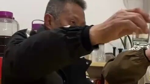 The woman replaced her father's wine with a drink. Her father's teeth were already broken, but the d