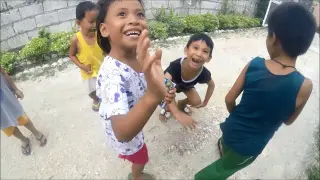 PHILIPPINES CHILDREN LAUGHING AND GIVING HIGH FIVES