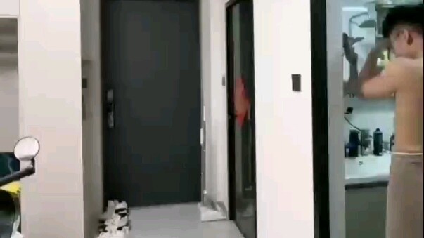 A muscular guy is home alone; after delivering the food, the delivery guy leaves and then comes back