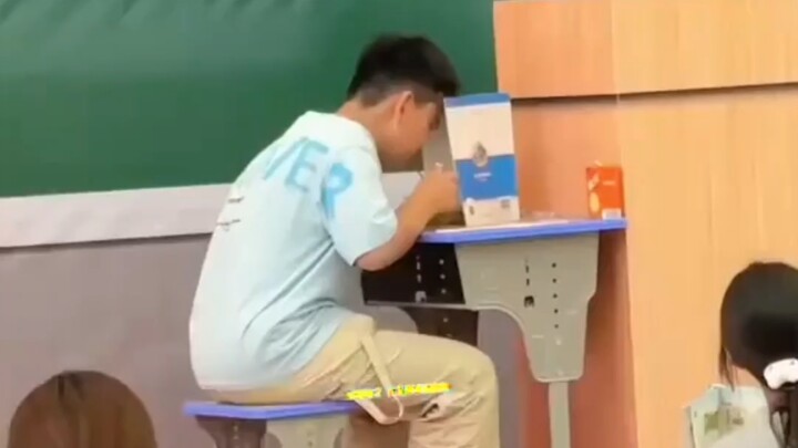 The most brazen snack-stealing scene in history—right with the teacher standing nearby! The kid tota