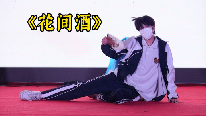 Male college student dances energetically on the sports field (shocking the leaders and classmates i