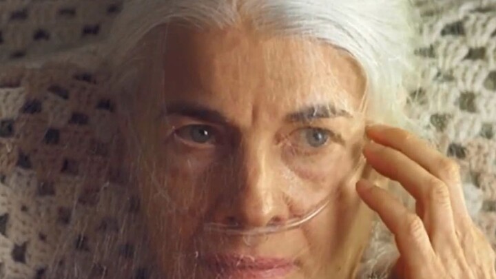 An elderly woman wakes up to find her face completely wrapped in silken threads spun by caterpillars