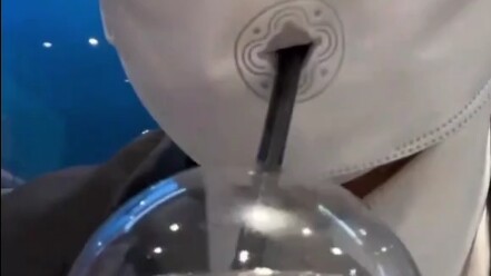 The company issued employees masks specially designed for drinking beverages—this invention is world
