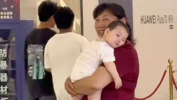 One second she’s snuggling up to Grandma, all clingy and cute—but the moment she sees Mom, she burst