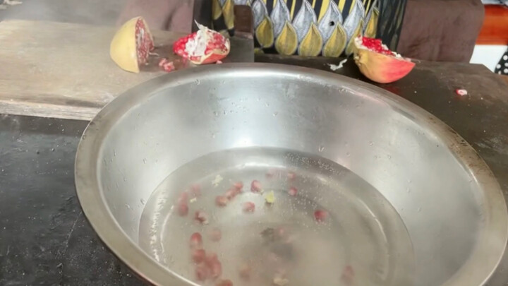 Blind mother cooks pomegranate soup for son with cerebral palsy