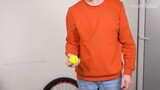 60 tennis balls = two bicycle wheels