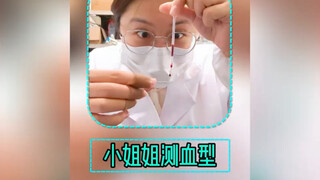 The young lady takes a lab class and tests her own blood type