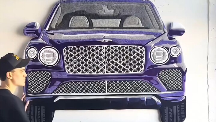 "Karya seni tekstil yang dibuat dengan teknik tufting"