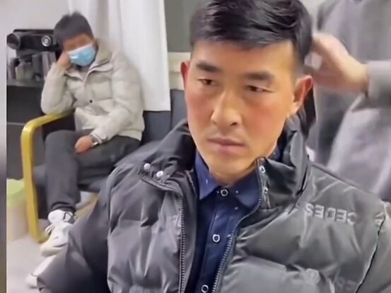 The uncle wearing a wig beams with joy, as if he’s been transported back to his youthful days.