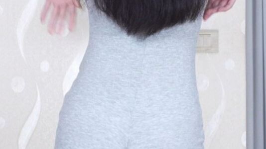 Feline Grace in a Sleek Gray Jumpsuit | Back View C3605