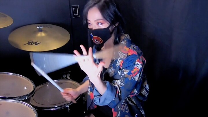 The young lady gives a cool drum performance to “LOL, LOL”—so awesome!