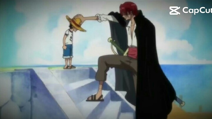 Shanks memberikan topi jeraminya kepada luffy