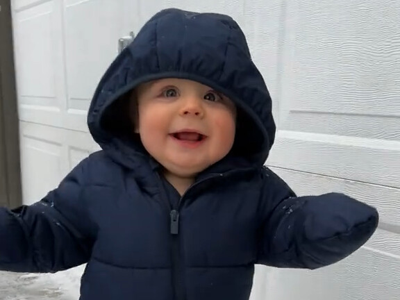 Baby’s first time playing in the snow ❄️! So cute like a little penguin 🐧—awww!