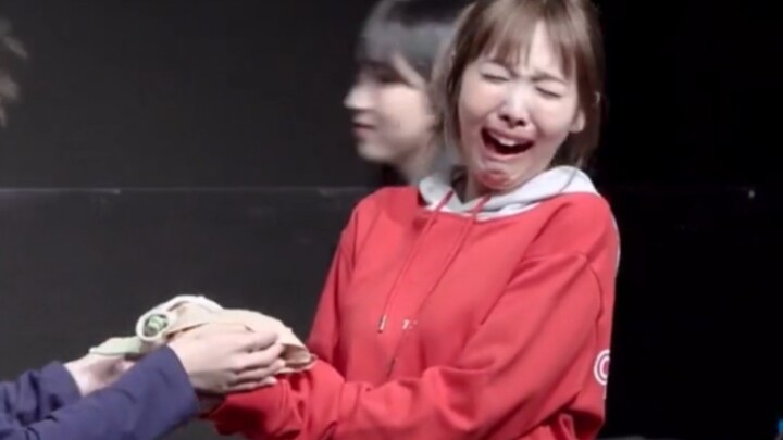 If you don’t know, just ask: Is that a lump of poop in Lin Nayeon’s hand?