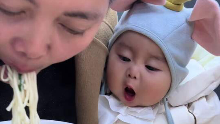 A seven-month-old baby has just sprouted a tiny tooth and already shows such a strong appetite for f