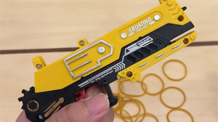 A boy’s happiness is surprisingly simple: just give him a rubber-band gun, and he’ll be entertained 