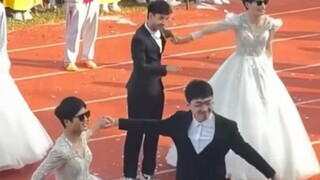 大学运动会开幕式，男生穿上婚纱上场表演，“看表情就知道是谁吵着要表演的” #校园  #整活