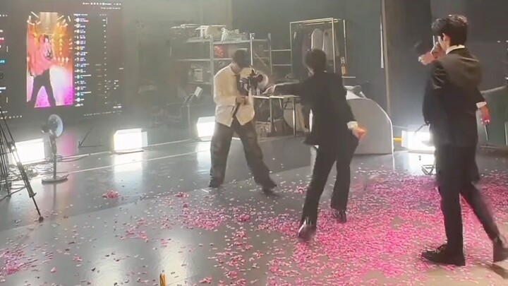 A CEO on stage, a janitor off stage
