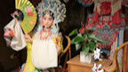 Step into the theater and watch the opera version of the Four Beauties.