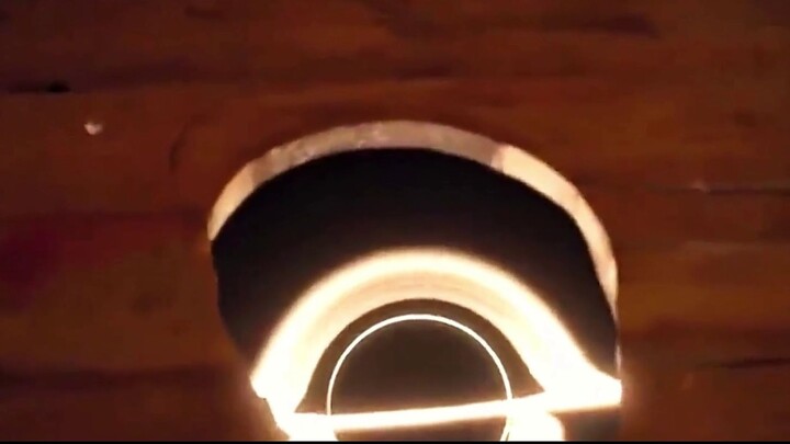 To his astonishment, the man discovers a time-traveling black hole hidden beneath his outhouse.