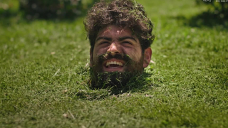 Creepy ad: Suddenly, many heads sprout from the lawn...