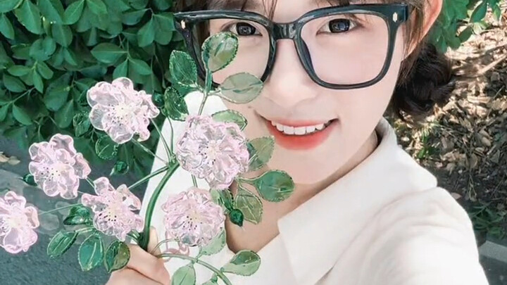 A heart of a tiger, yet it gently sniffs the roses.