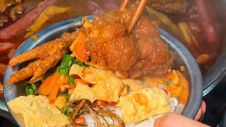 Local Liuzhou residents line up for this super-spicy snail noodle soup—pair it with pig trotters, an