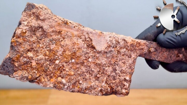 A craftsman refurbished a rusty old kitchen knife