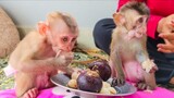 Little Toto & Yaya sit down gently enjoys eating and sharing fresh fruit together