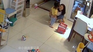 A scene captured on camera: a 2-year-old daughter knocks over her mom's lunchbox
