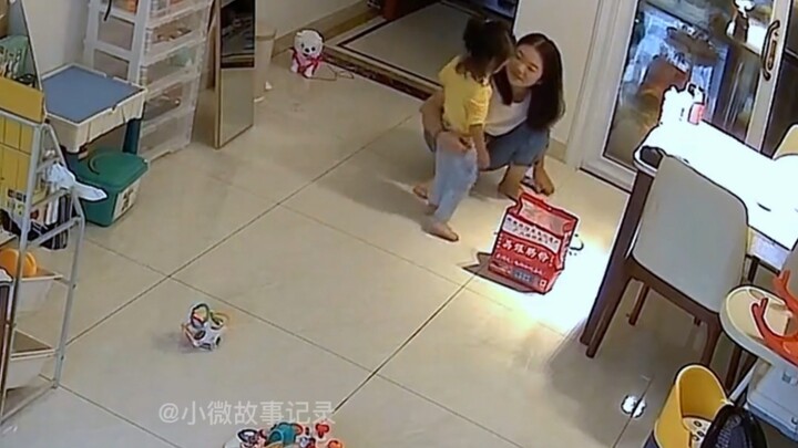 A scene captured on camera: a 2-year-old daughter knocks over her mom's lunchbox