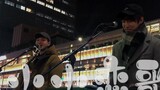 Singing "Little Love Song" on the streets of Japan to propose a big battle