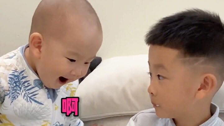 The cute kid tried his best to please his brother who stutters. He is so flexible at such a young ag