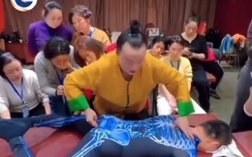 A grand master presses the young man’s Ren and Du meridians, seemingly clearing the blockage in his 