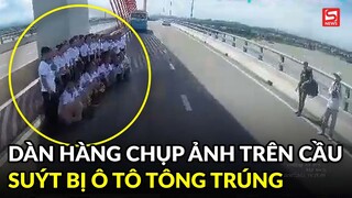 Nhóm người dàn hàng chụp ảnh trên cầu suýt bị ô tô tông trúng