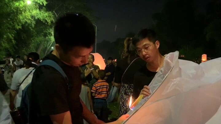 Everyone is busy making water lanterns. The sky lanterns are a little watery and the video editing i