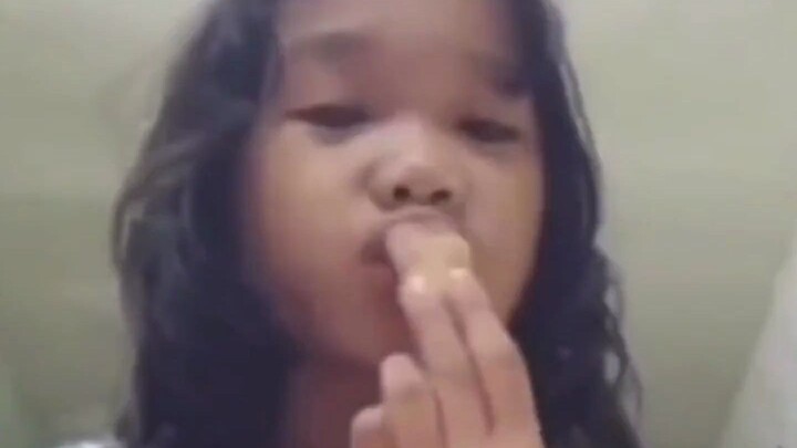 A gecko accidentally falls onto a half-eaten ice cream.