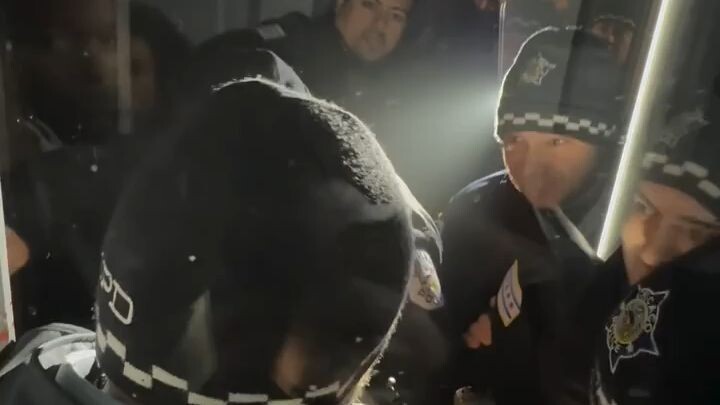 Police officers try breaking into private property