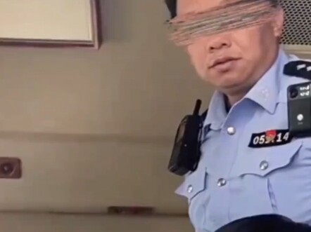 A man dressed in women’s clothing was turned away at the entrance to the Forbidden City. A police of